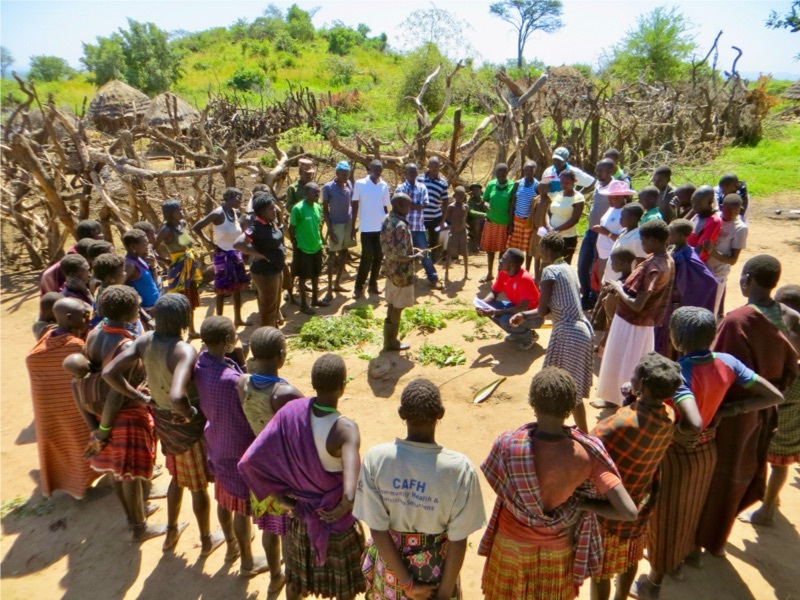 A large group of people in a circle.
